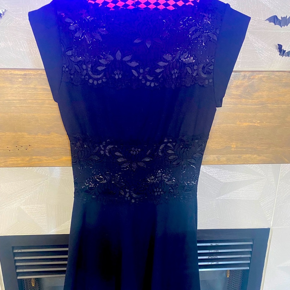 Black BEBE mini dress with lace chest and midriff.